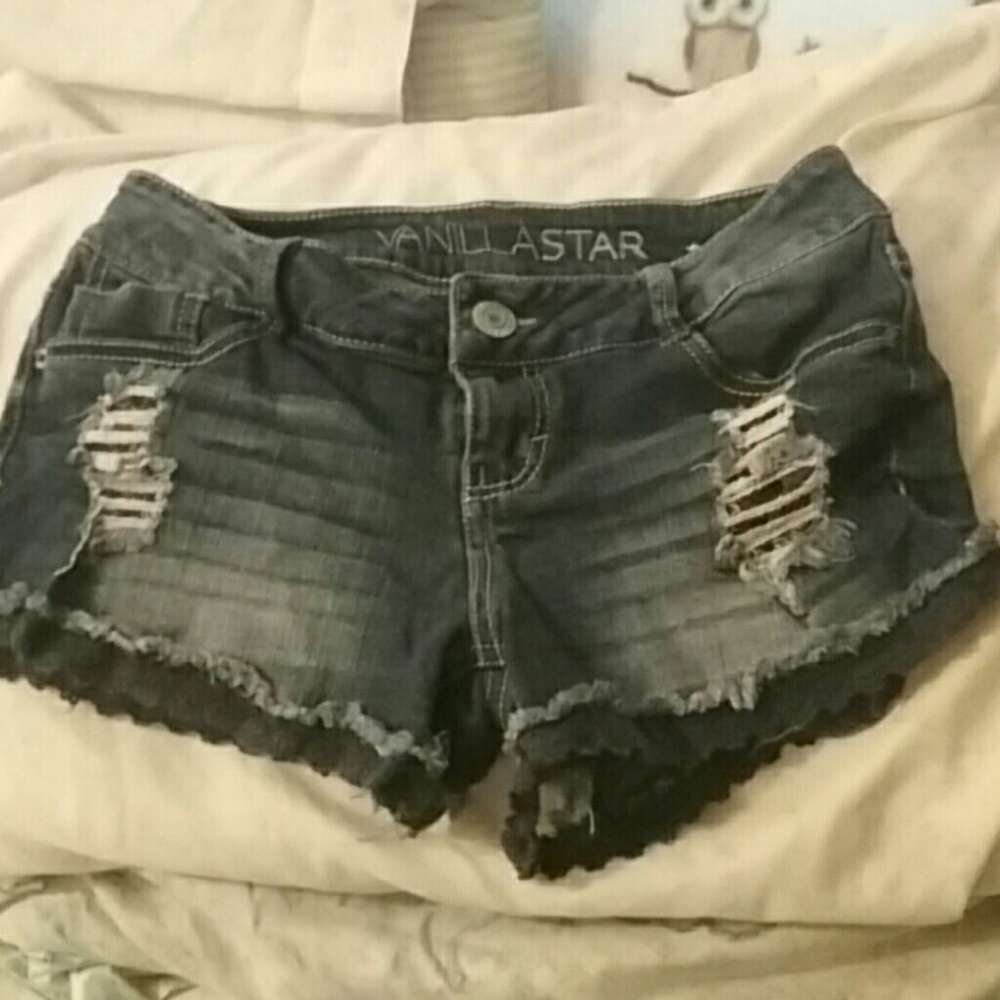 Denim shorts with dark blue frill at the ends